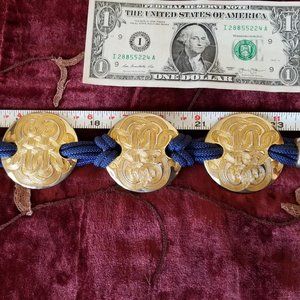 NAVY LEATHER LIKE BELT WITH GOLD LOOKING METAL ACCENTS